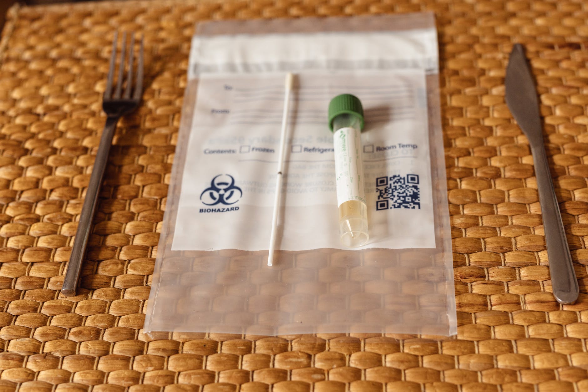 swab testing kit on a straw placemat